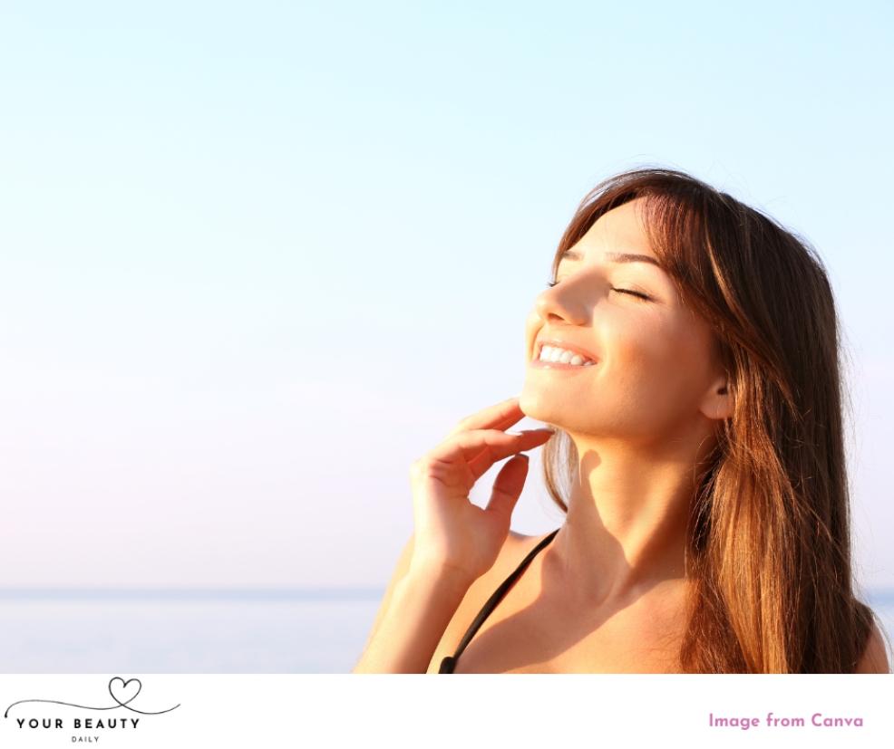 picture of a happy woman outside in the sun