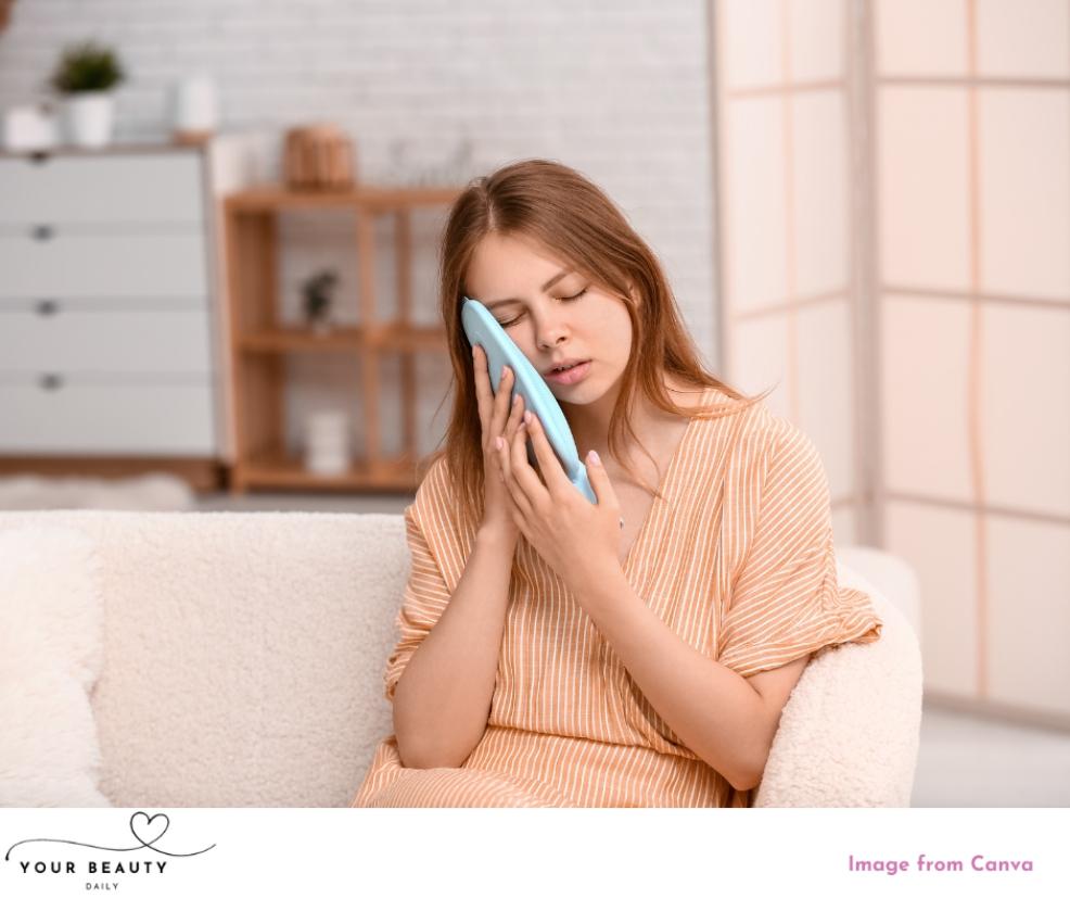 picture of a woman using a cold compress to soothe irritated skin