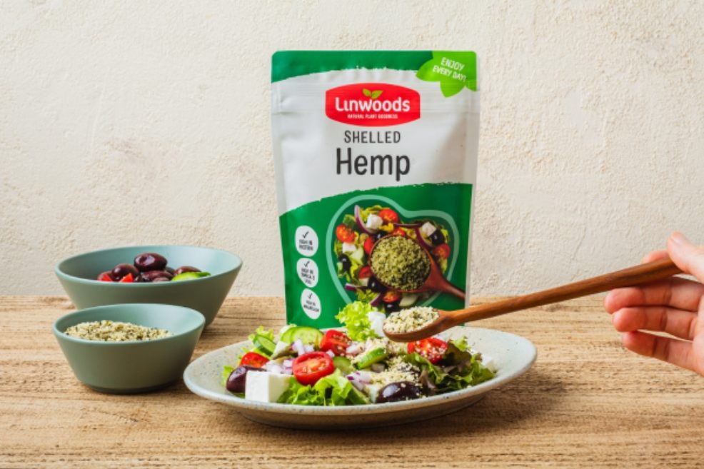 picture of Linwoods shelled hemp packet next to a plate of salad