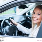 picture of a mum with natural make up in a car on the school run