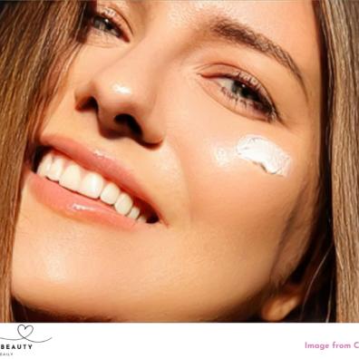 picture of a woman with suncream on her face