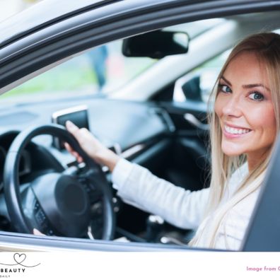 picture of a mum with natural make up in a car on the school run